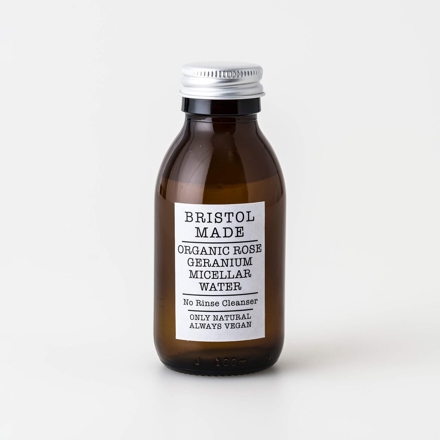 Brown bottle of Bristol Made organic rose geranium micellar water on a white background