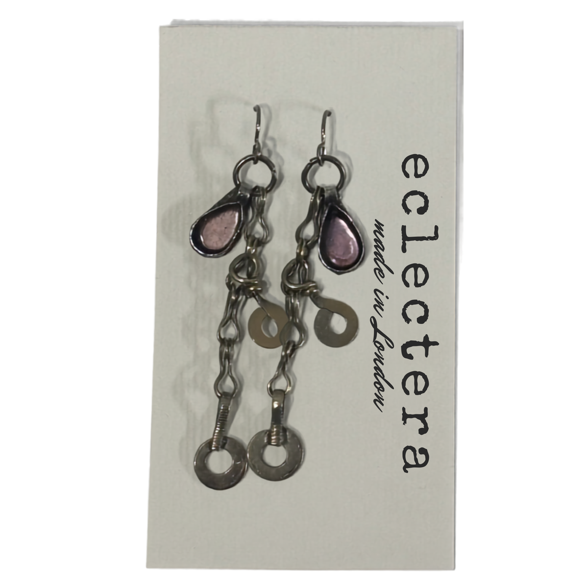 A pair of silver-toned dangle earrings with teardrop-shaped pink stones and circular chain links, displayed on a white card printed with the brand name 'eclectera'.