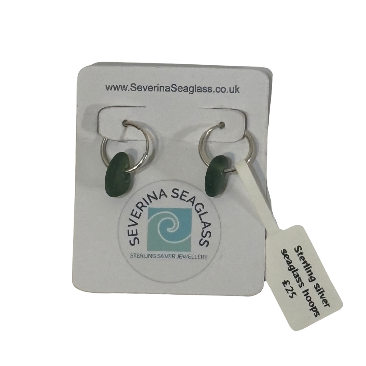 A pair of sterling silver seaglass hoop earrings with dark green oval stones, displayed on a white Severina Seaglass brand backing card with a price tag attached.