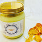 Jar of 'Natures Zest' candle with a gold lid on a white background