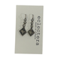 A pair of silver-toned dangle earrings with textured square charms, displayed on a white card printed with the brand name 'eclectera made in London'.