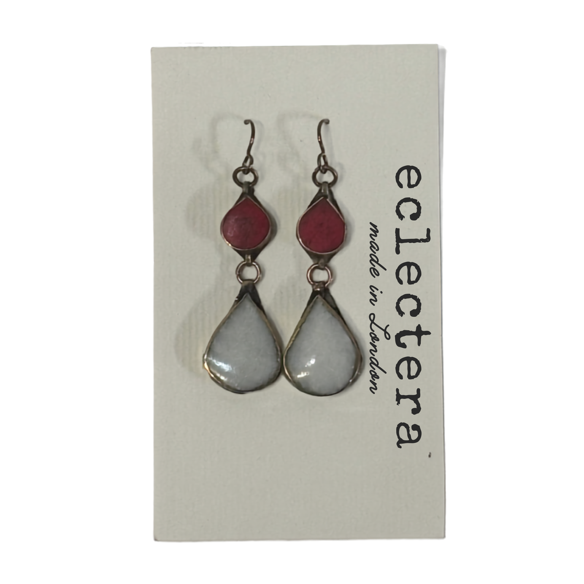 A pair of teardrop-shaped dangle earrings displayed on a white card. Each earring has a small dark red teardrop above a larger pale gray teardrop with a silver-toned metal border and hook.