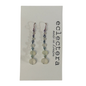 A pair of long beaded drop earrings displayed on a white card. The earrings feature a mix of translucent white beads, small dark beads, and silver-toned metal links and hooks.
