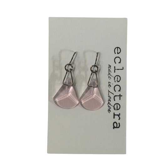 A pair of silver-tone dangle earrings with faceted light pink teardrop-shaped drops, displayed on a white card labeled 'eclectera made in London'.