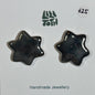 Glossy Black Ceramic Star Stud Earrings by Lili Toth