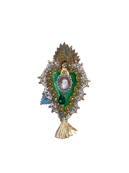 Decorative brooch with portrait on a wooden surface