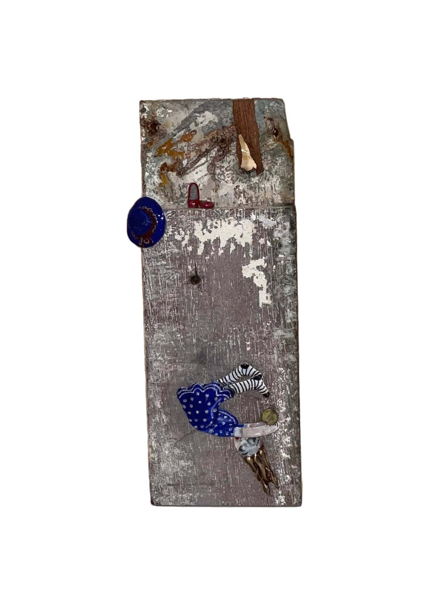 Decorative wall piece with various small objects on a wooden surface