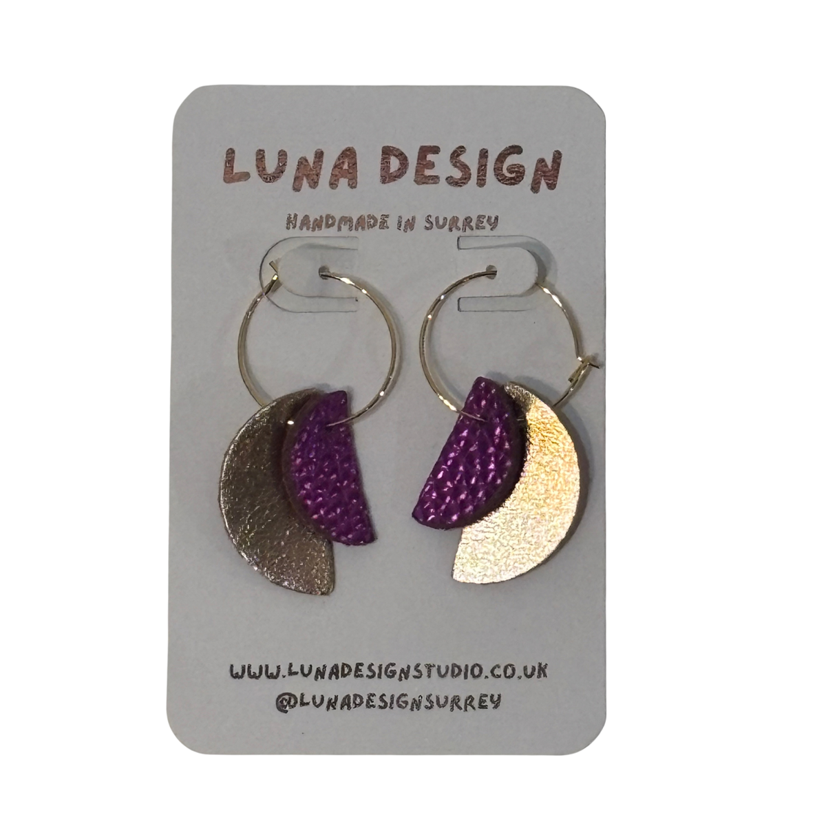 half moon earrings. Lightweight leather shapes hang from 20mm gold plated hoops for a bold, light-catching look.