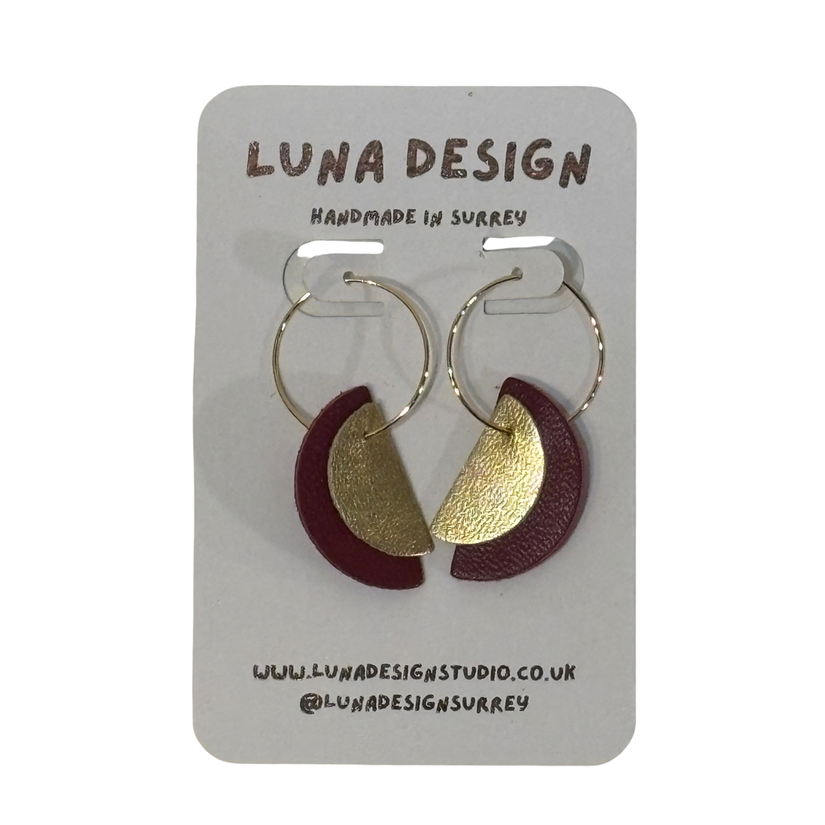 Make a statement with these striking half moon earrings. Lightweight leather shapes hang from 20mm gold plated hoops for a bold, light-catching look.
