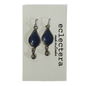 A pair of silver-toned dangle earrings with teardrop-shaped dark blue lapis lazuli stones and small dangling beads, displayed on a white card printed with the brand name 'eclectera made in london'.