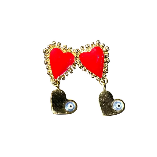 Heart-shaped earrings with red hearts and gold accents on a gray surface