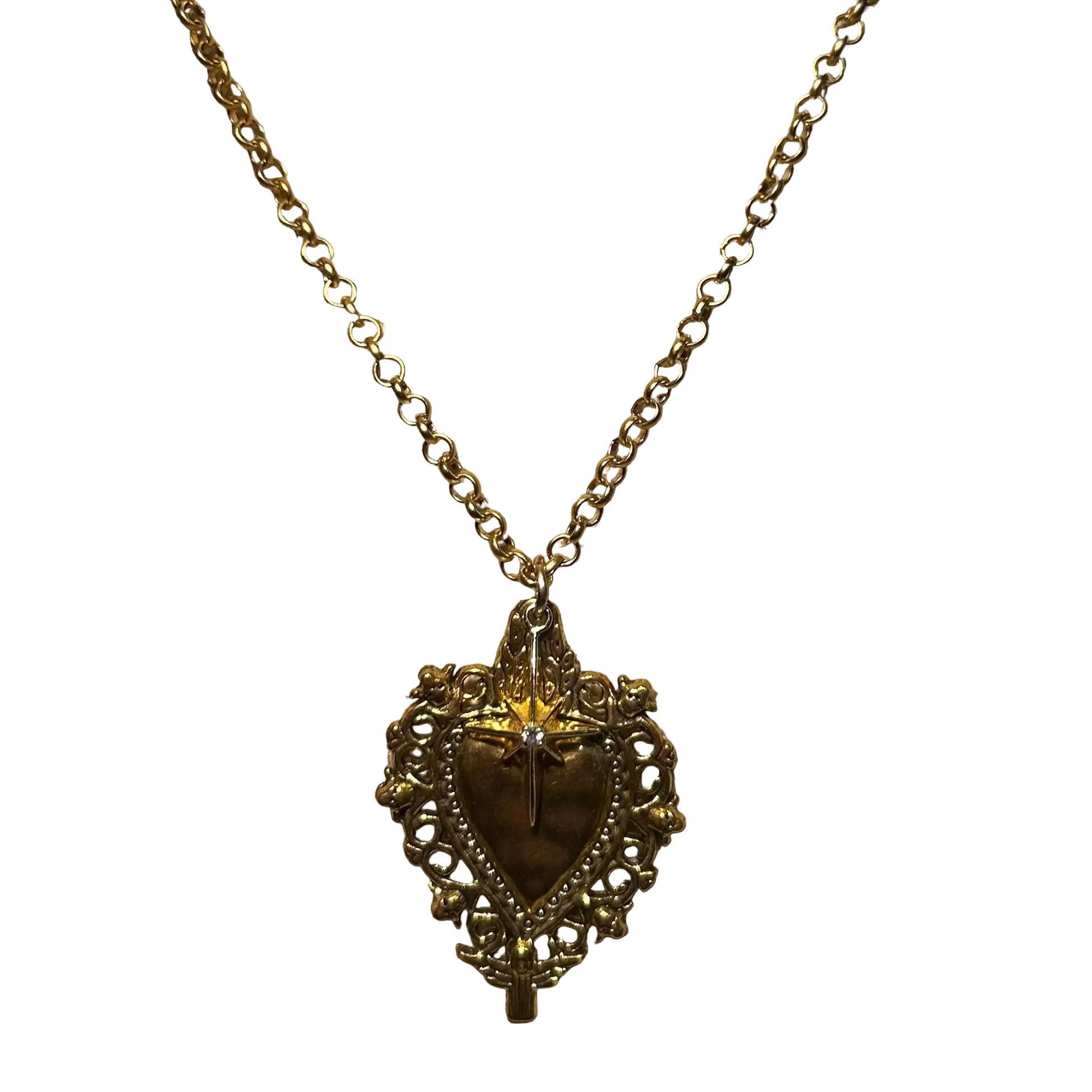 Gold necklace with a heart-shaped pendant on a mannequin bust.
