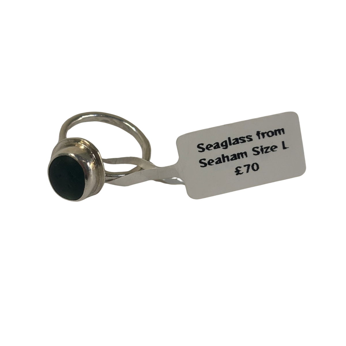 A silver-toned ring with a round dark green seaglass stone from Seaham, size L.