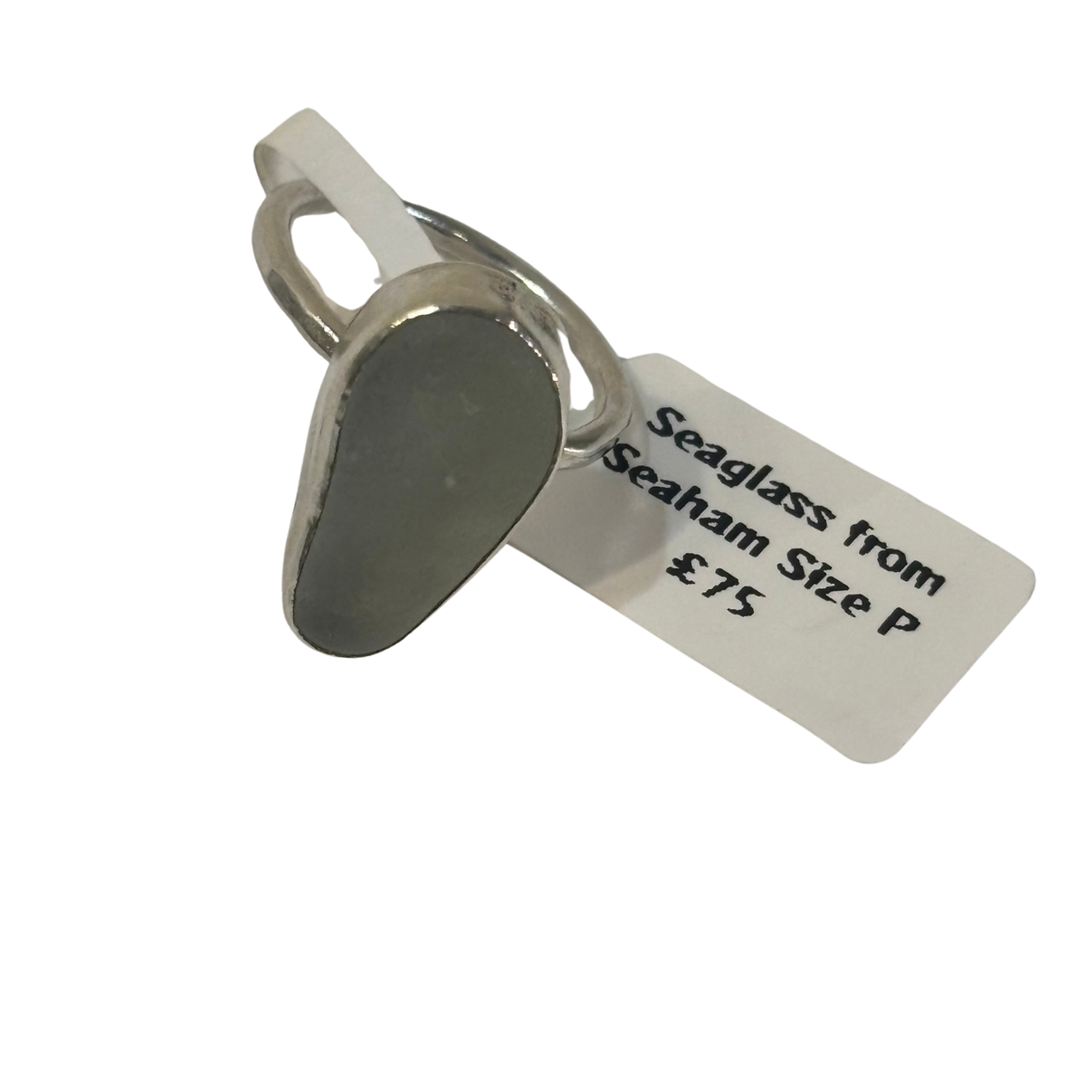 A single teardrop-shaped seaglass pendant with a silver-toned metal loop and a white paper tag attached, labeled 'Seaglass from Seaham Size P £75', on a plain white background.