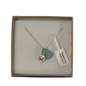 A frosted piece of green glass with collected from Japan, paired with a sterling silver starfish hung on a sterling silver 18 inch belcher chain.