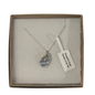 A frosted piece of glass collected from Dorset, paired with a sterling silver shell hung on a sterling silver 18 inch belcher chain.