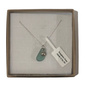 A frosted piece of green glass with collected from Japan, paired with a sterling silver shell hung on a sterling silver 18 inch belcher chain.