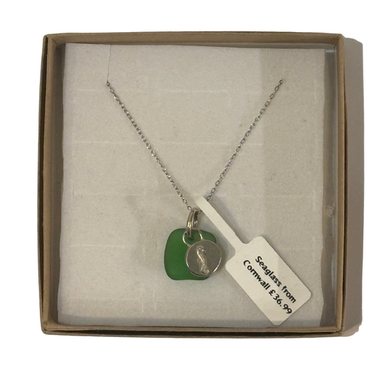 necklace in sterling silver with seglass pendant from cornwall and a silver pendant engraved with a seahorse.