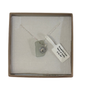 A frosted piece of white glass with collected from Isles of Scilly, paired with a sterling silver shell hung on a sterling silver 18 inch belcher chain.