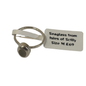 A small silver-toned seaglass ring with a white paper tag attached, reading 'Seaglass from Isles of Scilly Size M £69', on a plain white background.