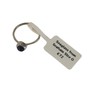 A single seaglass ring with a small oval dark blue stone set in a silver-toned bezel, attached to a white paper tag that reads 'Seaglass from Seaham Size 0 £72'.